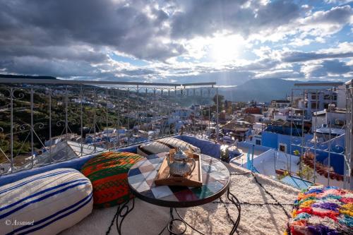 The stunning rooftop terrace of Riad Mosaic overlooking the blue-washed city of Chefchaouen