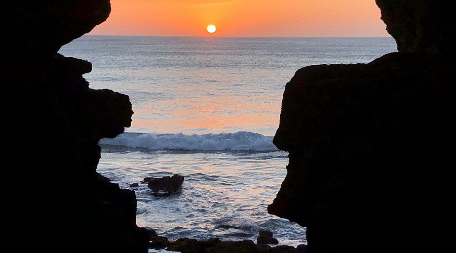 The iconic Hercules Caves in Tangier at sunset, looking out over the Atlantic Ocean